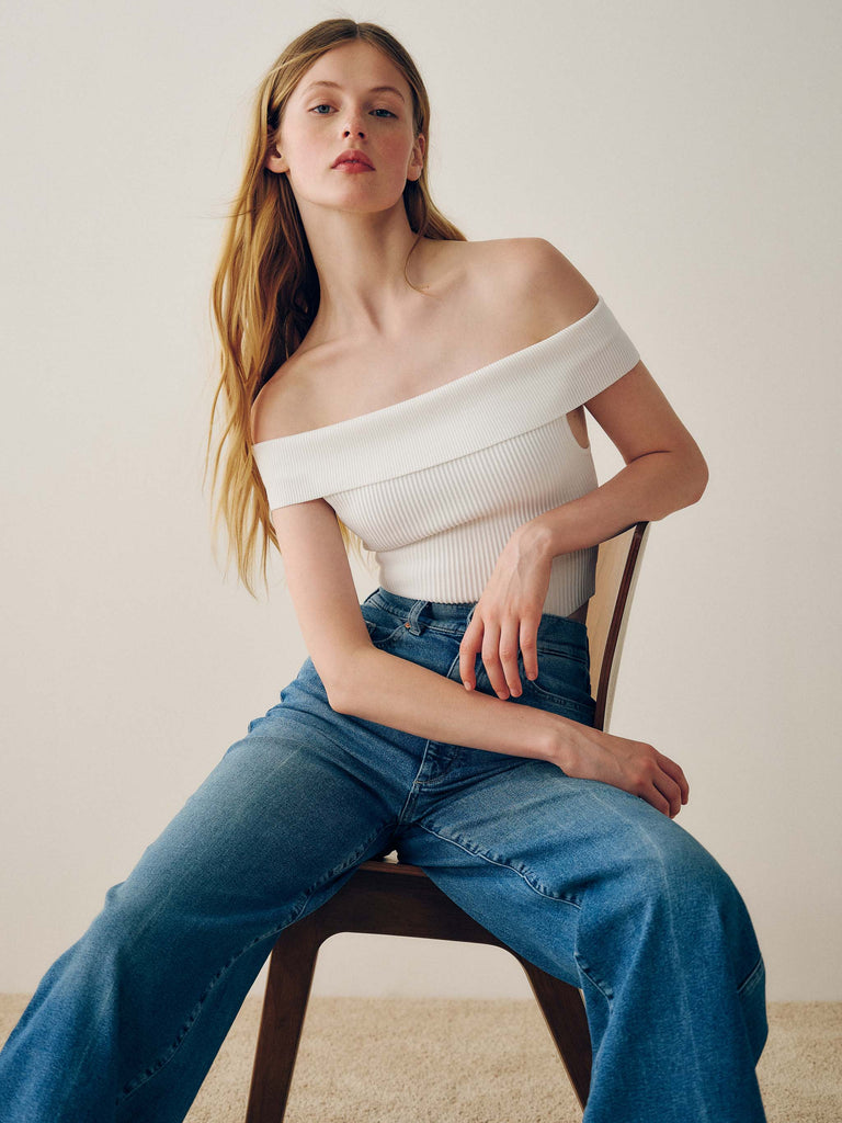 Off-shoulder top with high-waist jeans