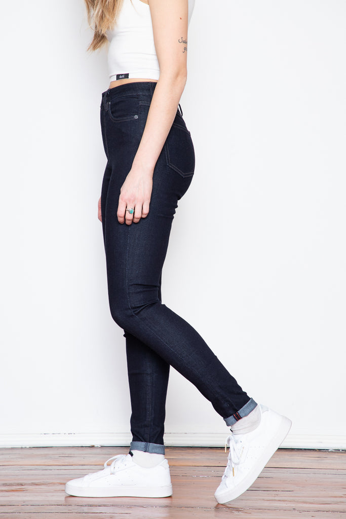The dark indigo of raw denim is coupled with the luxurious softness of stretch. These high-rise skinny jeans are a great option if you're looking for a go-to pair of comfortable jeans with a higher rise.