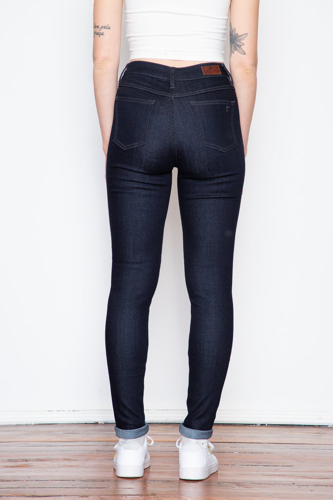 The dark indigo of raw denim is coupled with the luxurious softness of stretch. These high-rise skinny jeans are a great option if you're looking for a go-to pair of comfortable jeans with a higher rise.