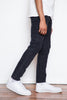Why We Love It: The quintessential tapered jean that follows the natural shape of your body.  Details: Fabric from Candiani Mills in Italy (emphasized by a single gold rivet on the coin pocket), buttons, rivets, & jacron patch from Italy, five button fly.  Fit: High rise with slight suppression at the waist, a little more room in the thigh, and a beautiful taper that follows the shape of the leg.  Colour: Washed black  Composition: 98% cotton, 2% elastane   Origin: Made in Portugal
